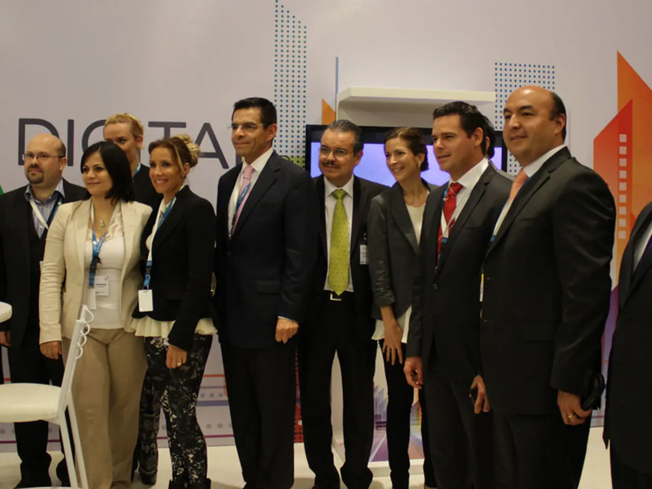 In the center of this picture we can see the group of persons wearing suits and standing and we can...